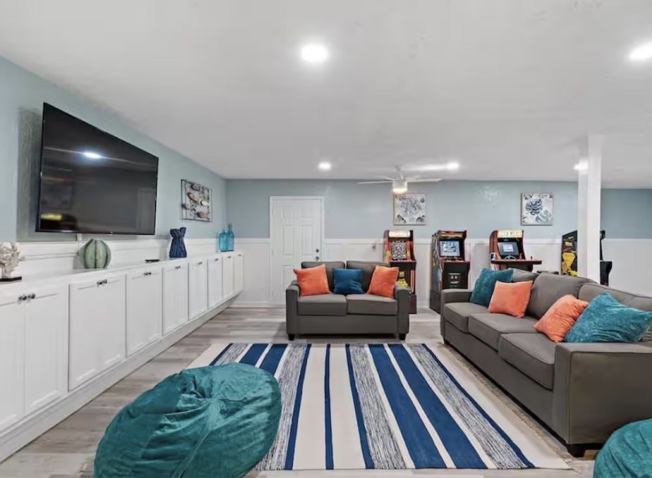 Lounge with arcade cabinets, sofas, and bean bags