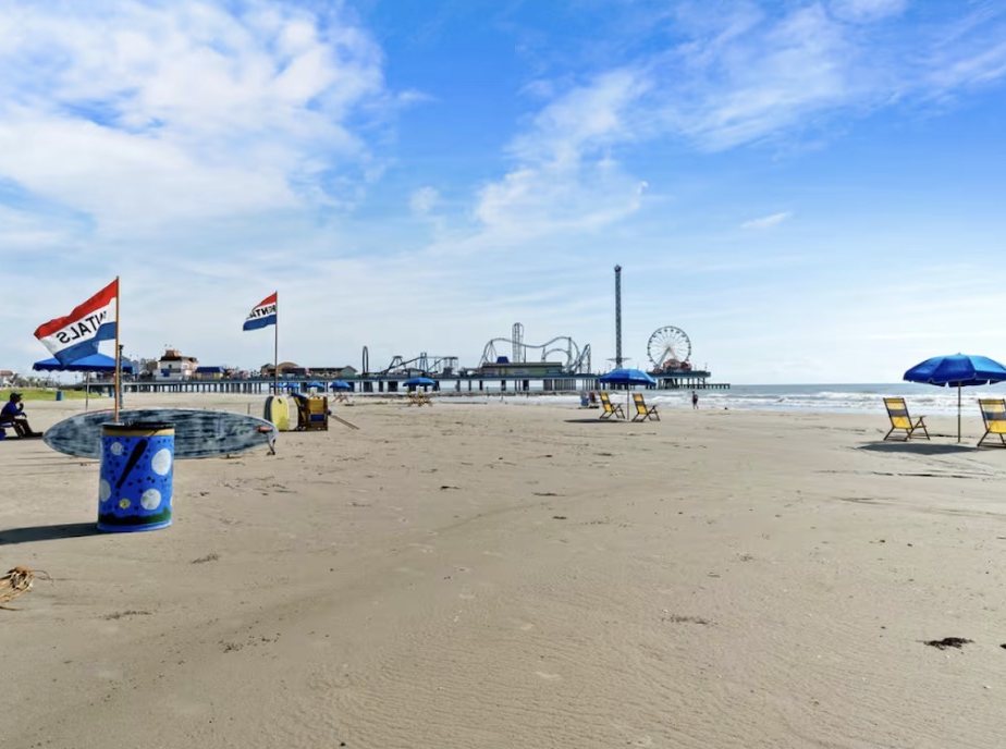 Galveston beach with the Pleasure Pier in the distance