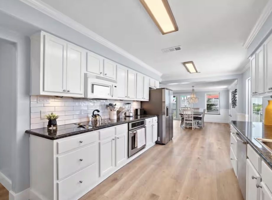 Full kitchen opening into the dining room