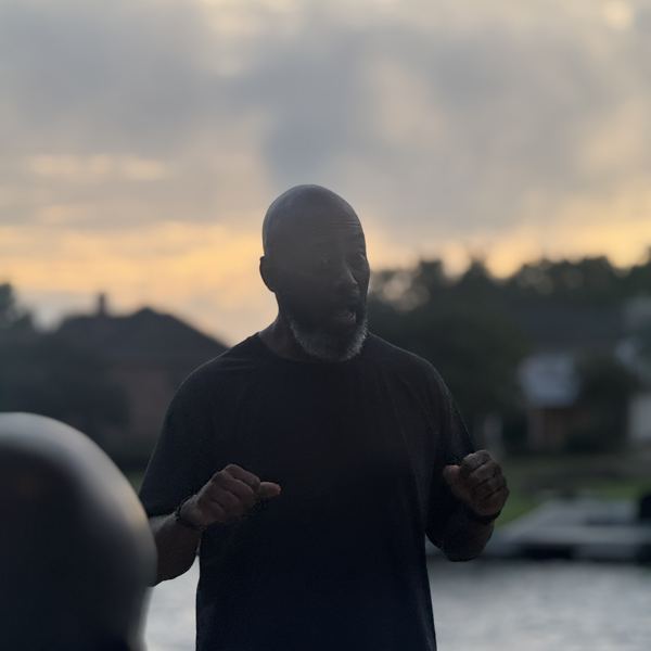 Preaching on the deck at sunset