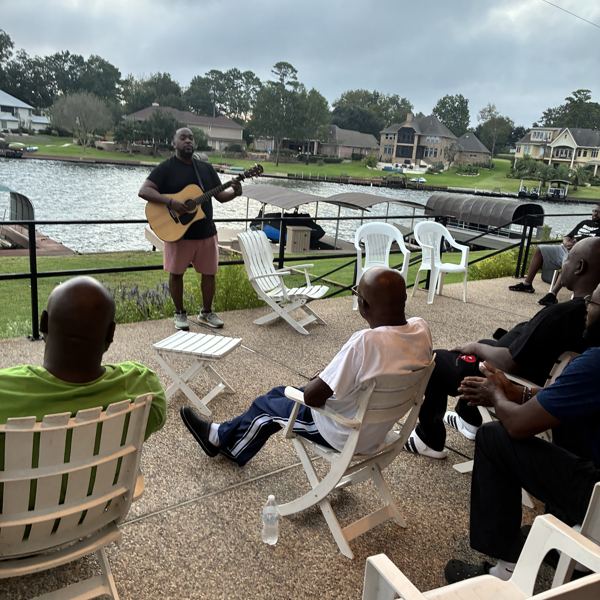 Guitar worship by the water